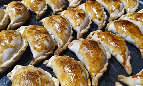 an image of empanadas at a street food stall in Buenos Aires