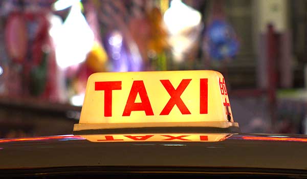 A red taxi with a yellow light in Costa Rica