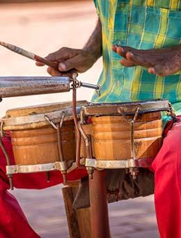 cuban man playing drums cuban music at festival in cuba