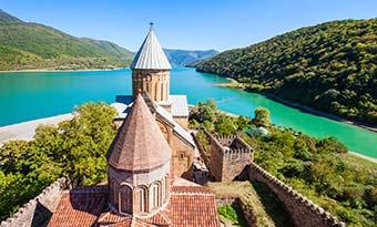 caslte on the banks of a river in Ananuri Georgia Europe