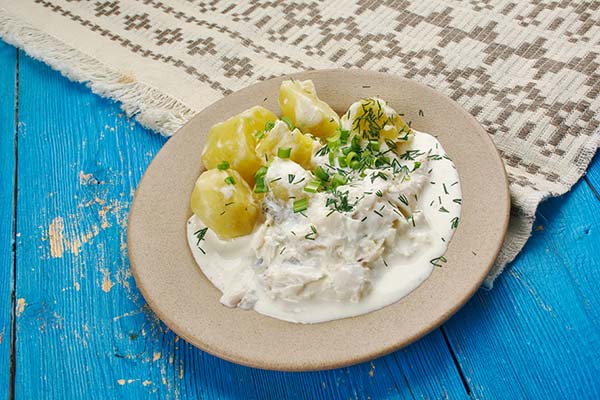 traditional authentic fish stew on blue wood strips in iceland