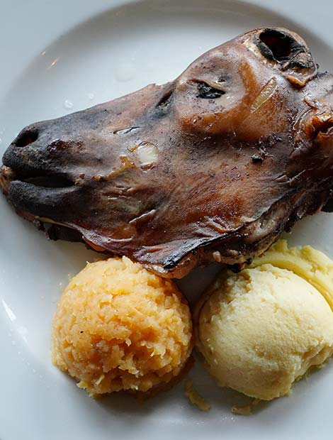 seared sheeps head and potato mash traditional icelandic food at Thorri feast in iceland