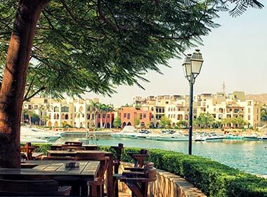 restaurant overlooking beautiful marina and port on a sunny day in aqaba jordan