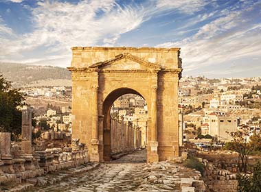 large gateway to roman city ruins of jerash on a group holiday to jordan