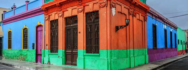 tour group on holiday are taken by a tour guide through the vibrant streets of callao in lima