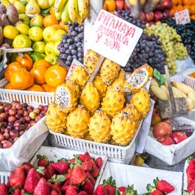 Peruvian market stalls selling local fruit and vegetables, explore when on a holiday tour to Peru