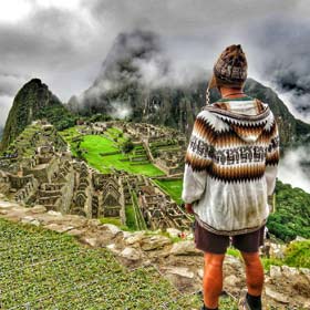 Female solo tourist on holiday with a group travel trip on the Inca Trail hike enroute to Machu Picchu, Peru