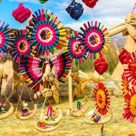 Colourful celebrations also travel souvenirs for holiday makers from Lake Titicaca located near Puno, Peru