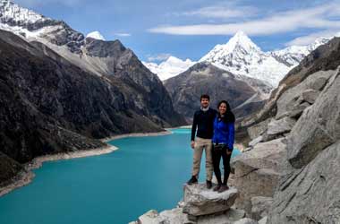 recent married couple in cordillera blanca on a hike thrpough the andes mountains whilst on their honeymoon tour of peru