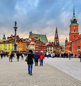 people walking in a street in warsaw poland