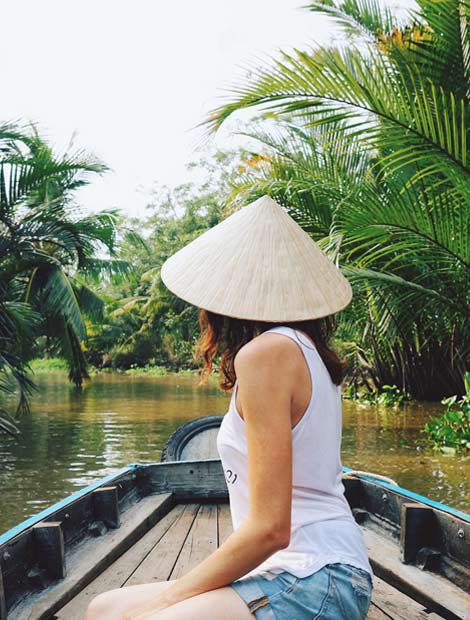 Female solo holiday maker explores the Mekong Delta, Vietnam