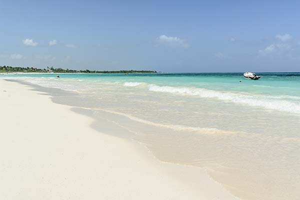 white sand secluded beach and clear blue water at xpu-ha beach mexico