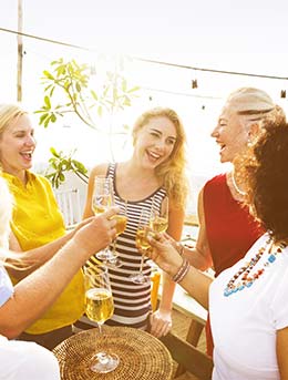 a group of people doing a toast with wine at the capes times waterfront wine festival in south africa