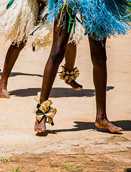 legs of people dancing at the royal reed dance in south africa