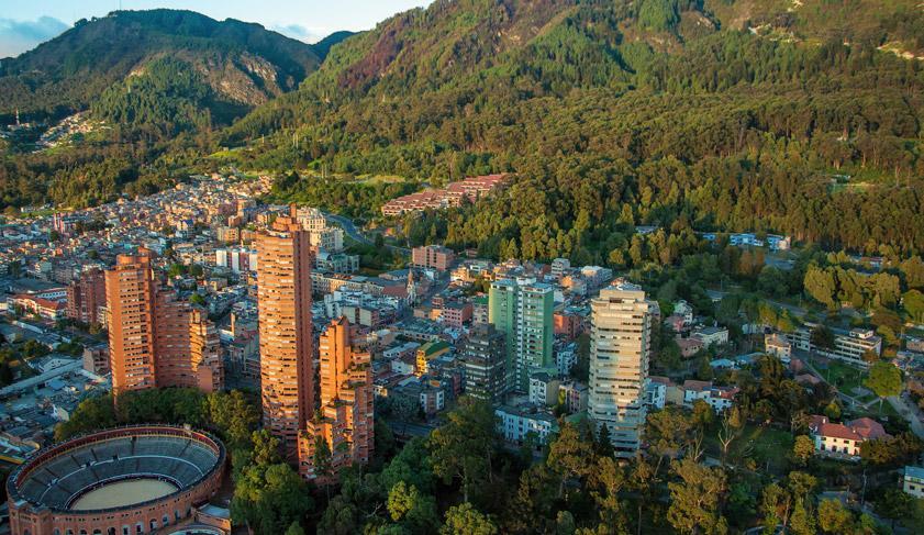 A view of the center of Bogota with the Andes in the background.