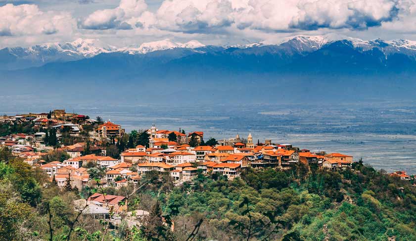A beautiful panoramic view of Telavi city in Georgia. Caucasus mountains and blue sky with clouds on the background