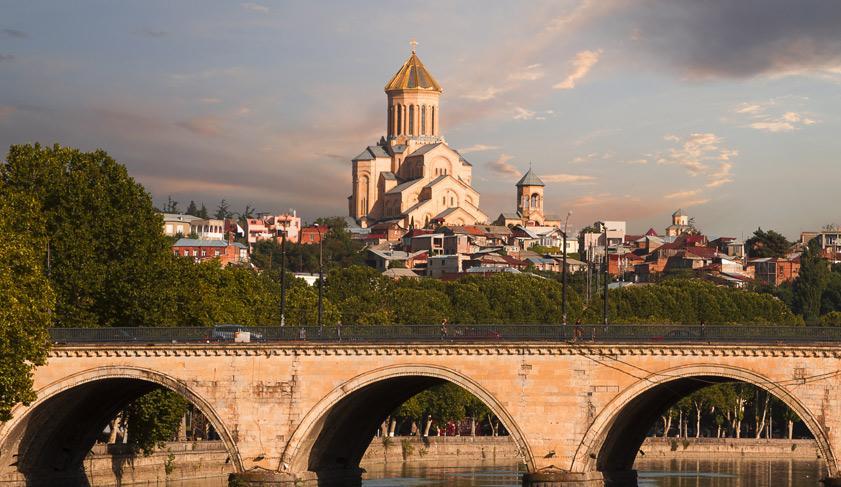 Saarbrucken bridge and Sameba Cathedral in Tbilisi