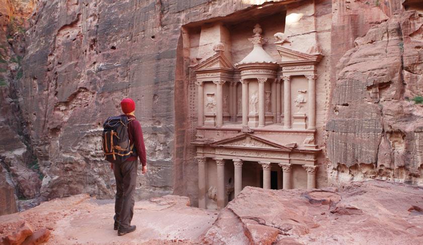 Traveller looking at the Treasury in Petra