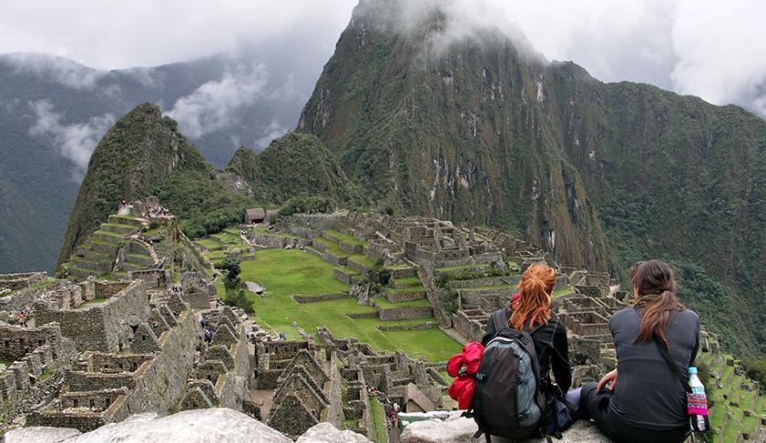 Sitting admiring the view over Machu Picchu, Peru