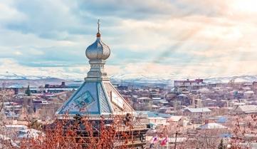 Panorama of the Giumri city and view of the dome of the church.