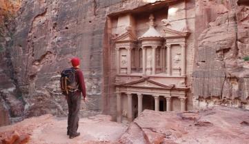 Traveller looking at the Treasury in Petra
